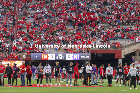 Husker recruits watch the pregame warmups from the field before the Nebraska vs Northwestern Univers