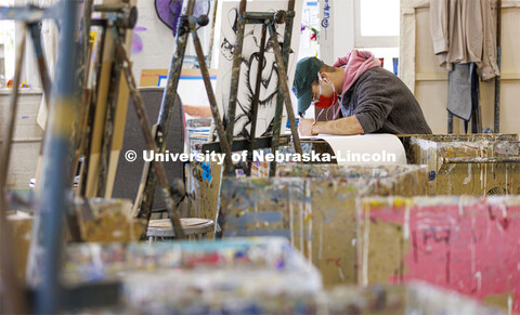 Javier Rivera, a senior from Omaha, works on his project in Aaron Holz’ Intermediate Painting clas