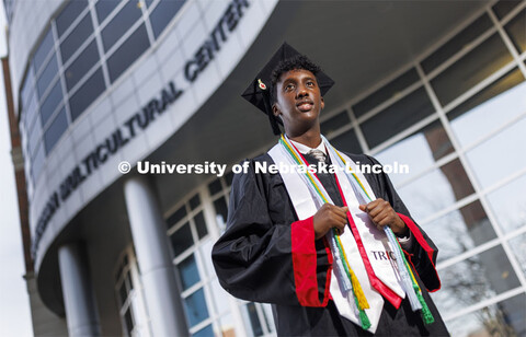 Khalid Yusuf, who served as a Diversity Ambassador, stands in his graduation regalia near the Gaugha