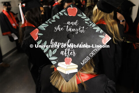 Decorated mortarboards at the Undergraduate Commencement at Pinnacle Bank Arena. December 18, 2021. 