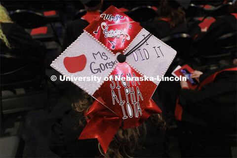 Decorated mortarboards at the Undergraduate Commencement at Pinnacle Bank Arena. December 18, 2021. 