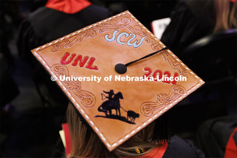 Decorated mortarboards at the Undergraduate Commencement at Pinnacle Bank Arena. December 18, 2021. 