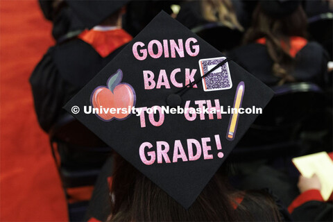 Decorated mortarboards at the Undergraduate Commencement at Pinnacle Bank Arena. December 18, 2021. 