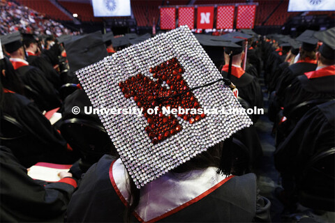 Decorated mortarboards at the Undergraduate Commencement at Pinnacle Bank Arena. December 18, 2021. 