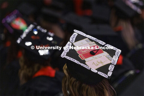 Decorated mortarboards at the Undergraduate Commencement at Pinnacle Bank Arena. December 18, 2021. 