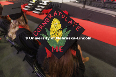 Sarah Burke gave her mortar board a corny look. Decorated mortarboards at the Undergraduate Commence