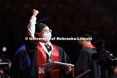 Jin Seng Cheng celebrates his engineering diploma. Undergraduate Commencement at Pinnacle Bank Arena