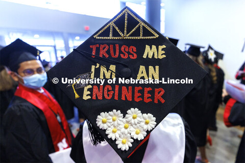 Decorated mortarboards at the Undergraduate Commencement at Pinnacle Bank Arena. December 18, 2021. 