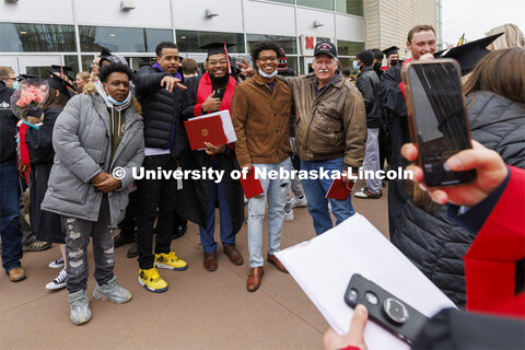 Myles Johnson poses with family and friends for a photo after the ceremony. Undergraduate Commenceme