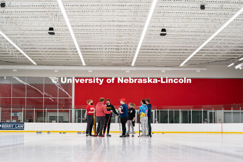 The University of Nebraska Curling Club speak to each other during practice at the John Breslow Ice 