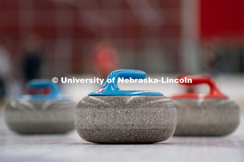 Three curling stones sit on the ice at the John Breslow Ice Hockey Center. Curling Club. February 1,