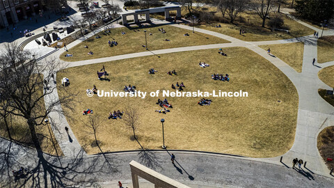 Aerial view of the City Campus green space filled with students laying out and soaking up some sun o