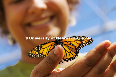 A Monarch butterfly rests on Miyauna Incarnato’s hand. Incarnato is a graduate student in Entomolo