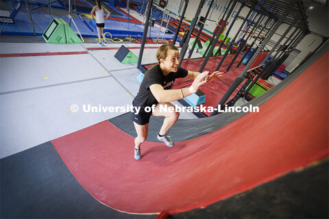 Leigh Jahnke runs up a warped wall while practicing in Lincoln to take part in the American Ninja Wa