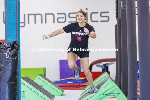 Leigh Jahnke runs across quad steps. Jahnke is participating on America Ninja Warrior television com