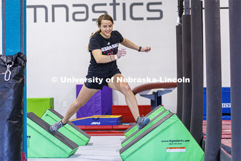 Leigh Jahnke runs across quad steps. Jahnke is participating on America Ninja Warrior television com