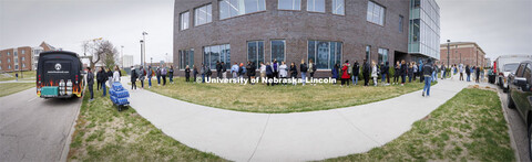 Lines of students snake through the grass in front of Cather Dining Center for Food Trucks @ Lunch. 