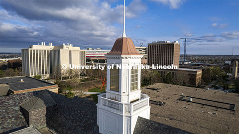 Detail showing chipped paint and water damage to the exterior of the Love Library cupola. The renova