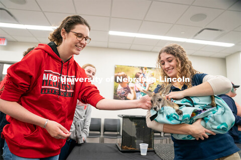 Students pet animals during the End of Year Bash inside the East Campus Union on Saturday, April 30,