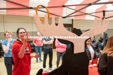 Students play carnival games during the End of Year Bash inside the East Campus Union on Saturday, A