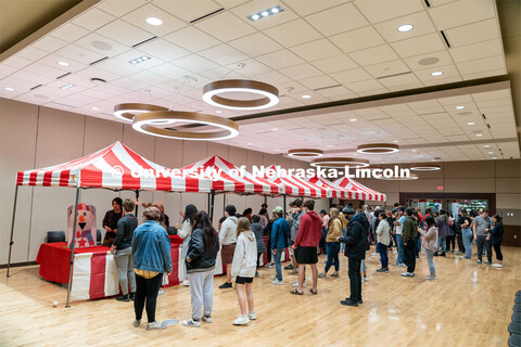 Students play carnival games during the End of Year Bash inside the East Campus Union on Saturday, A