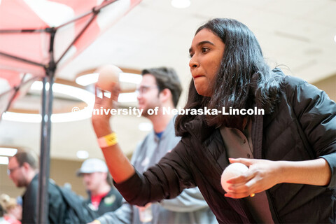 Students play carnival games during the End of Year Bash inside the East Campus Union on Saturday, A