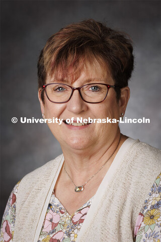 Studio portrait of Glennis McClure, Extension Educator. Portraits of Extension, IANR and CASNR educa