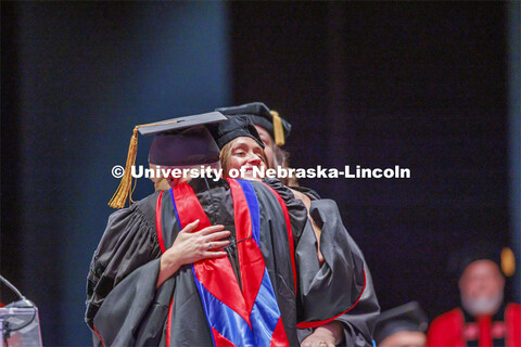 Hooding at graduate commencement in Pinnacle Bank Arena. May 13, 2022. 