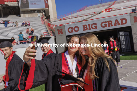 Kelly Shepsko and Matea Spyhalski take a selfie as they enter Memorial Stadium. UNL undergraduate co