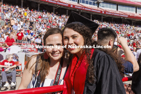 Ralston Ripp poses with her mom. UNL undergraduate commencement in Memorial Stadium. May 14, 2022. 