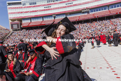 Kira Taylore hugs Olivia McCown before commencement. UNL undergraduate commencement in Memorial Stad