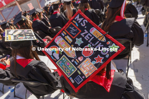 Decorated mortarboards at UNL undergraduate commencement in Memorial Stadium. May 14, 2022. 