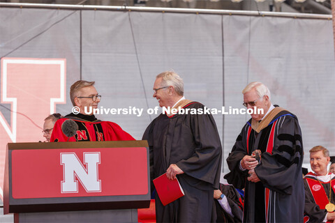 Terry Fairfield, center, along with UNL Chancellor Ronnie Green, left, and NU Regent Bob Phares. Fai