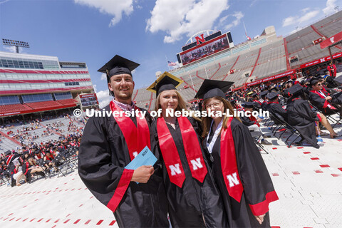 CASNR grads Caden Schuster, Kayla Schroeder and Elizabeth Schousek were the last graduates to walk t