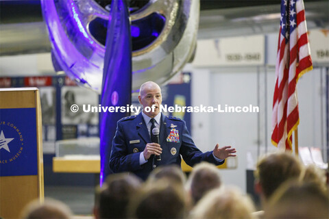 Lt. Gen. Thomas A Bussiere addresses the audience with a World War II era B-29 as a backdrop. Lt. Ge