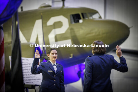 Second Lt. Isabel Welch recites the Oath of Office as directed by Air Force Major Nicole Beebe on Ma