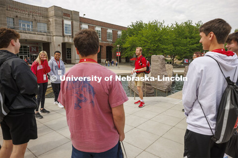 Jackson Anderson’s group of students talk before walking to Cather Dining Hall for lunch. New Stud