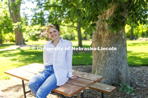 Ally Barry, a junior in environmental studies, sits in the arboretum on East Campus, one of her favo