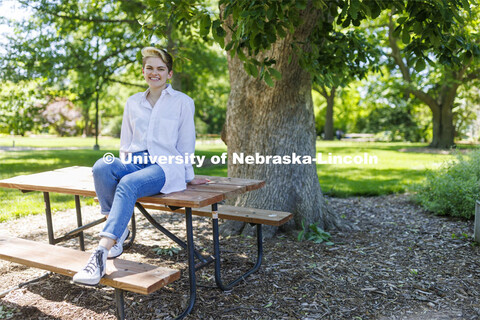 Ally Barry, a junior in environmental studies, sits in the arboretum on East Campus, one of her favo