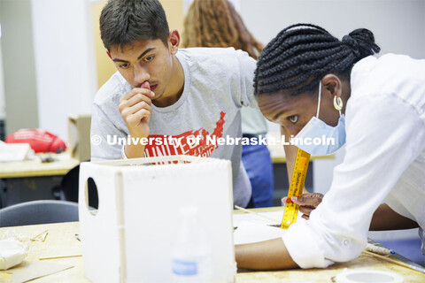 High school students in the College of Architecture high school camp work on their projects with Azi