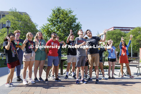Journalism professor Matt Waite and the 4-H Digital Media Big Red Academic Camp wave to the camera o