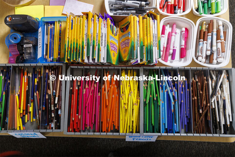 Bins of colored pencils and markers at an art station. Guy Trainin’s project is Art TEAMS: Nurturi