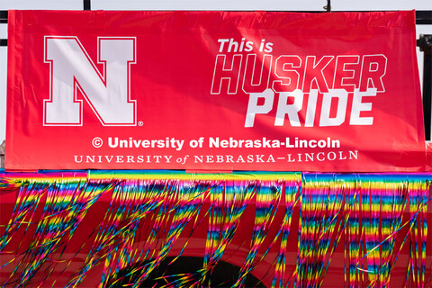 University of Nebraska representatives circle around the Capitol during the Star City Pride parade. 
