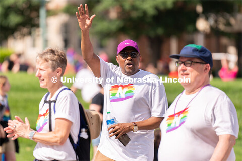 University of Nebraska representatives wave to the crowd during the Star City Pride parade. June 18,