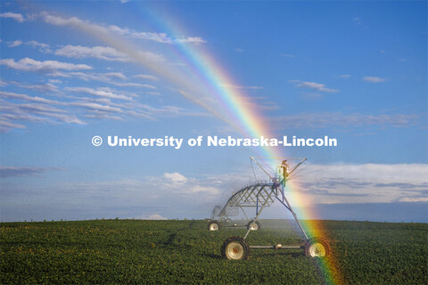 A center pivot northeast of Adams, Nebraska makes a rainbow in the evening sunlight. July 1, 2022. 