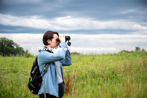 PhD Student Allison Barg looks and listens for different bird species while out checking acoustic mo