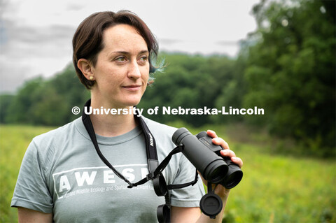 PhD Student Allison Barg looks and listens for different bird species while out checking acoustic mo