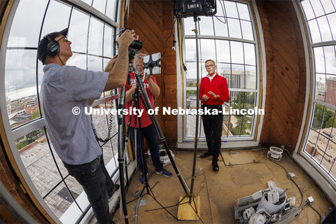 Dave Fitzgibbon and Curtis Bright of UCOMM film the Chancellor as he welcomes students back in his w