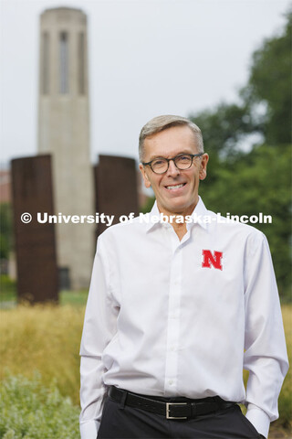 Chancellor Ronnie Green with the Mueller Bell Tower and Greenpoint sculpture in the background. Augu