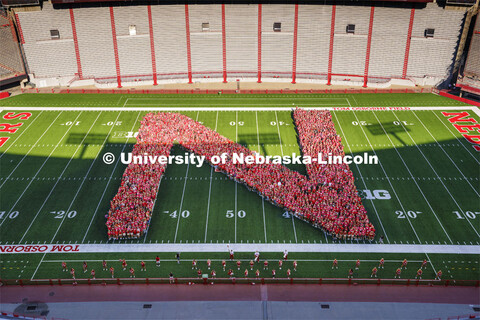 Freshman students form the N on the Memorial Stadium field for the class of 2026 photo. Tunnel Walk 